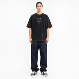 Model wearing the Phantom Grin Vintage Tee, front view
