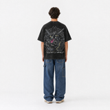 Model wearing the Onyx Ascension Vintage Tee, back view